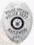 Detailed custom silver badge for Maplewood Police Officer, featuring an eagle at the top, black bold text "POLICE OFFICER POLICE DEPT." around the New Jersey state seal, "MAPLEWOOD" beneath it, and a number plate "1001," attached with a safety pin.