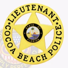 Metal badge in gold with a five-point star and circular border that reads "lieutenant cocoa beach police" in black letters, highlighted by the colorful state of florida emblem at the center, equipped with a safety pin backing.