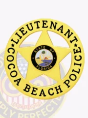 Bright gold custom badge showing a five-point star enclosed within a circular band inscribed with "Lieutenant Cocoa Beach Police" in bold black font, with the State of Florida logo prominently displayed in the middle, made for safety pin attachment.