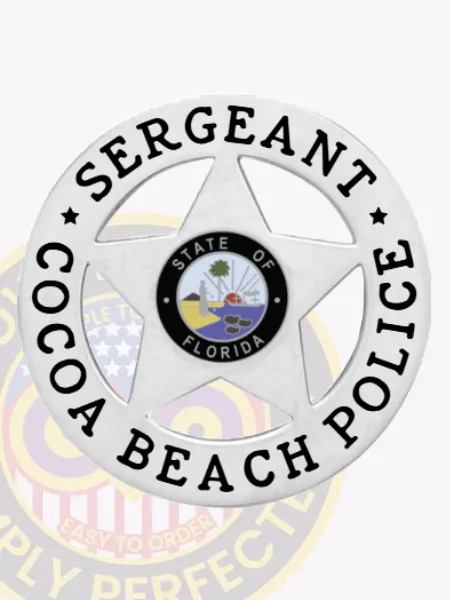Silver metal badge shaped in a circle with a large five-point star inside and black text reading "Sergeant Cocoa Beach Police" around the edge, featuring the State of Florida seal in the center, attached via safety pin.