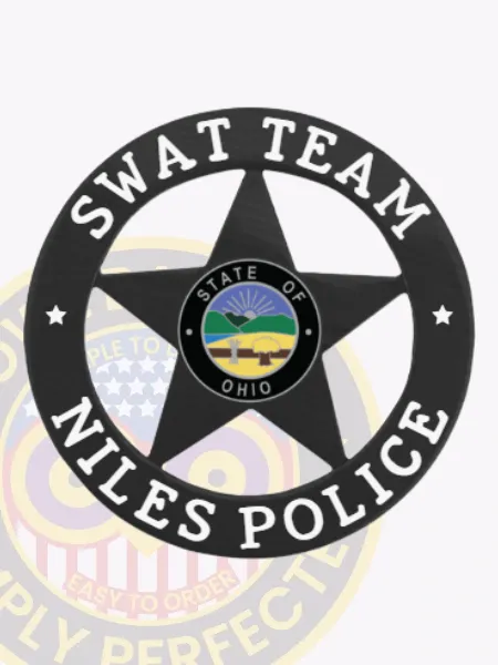 Custom black metal badge shaped as a 5 point star within a circular banner for Niles Police SWAT Team, featuring white lettering "SWAT TEAM" at the top and "NILES POLICE" at the bottom, central star displaying the police department seal from Ohio, equipped with a safety pin attachment.