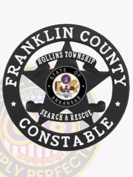 A stylish custom metal badge in black color showcases a prominent star motif encircled by the text "FRANKLIN COUNTY" and "CONSTABLE." The center features the Arkansas state emblem and the inscription "SEARCH & RESCUE," making it a distinctive piece, complete with a safety pin attachment for easy fastening.