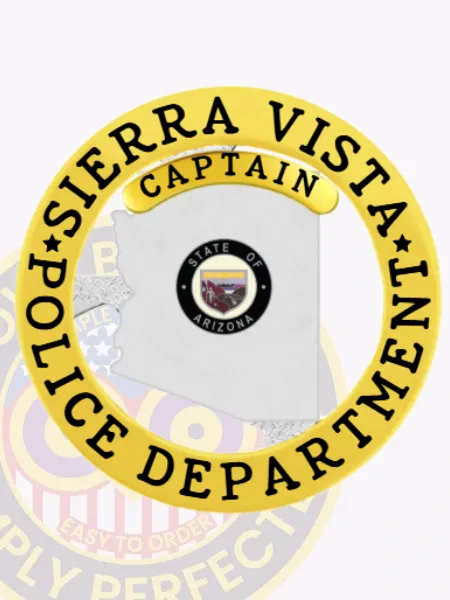 Custom silver Arizona badge for Sierra Vista Police Captain, showing the detailed Arizona state seal centrally placed within the silver state silhouette, bordered by a gold circular band with black text “Sierra Vista Police Department,” and a gold “Captain” label above, attached with a safety pin.