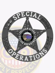 Pelican River Police Special Operations badge in custom black metal, shaped as a 5 point star inside a round banner displaying "SPECIAL OPERATIONS" in white letters, with the central star showcasing the Alaska state seal and police department name, secured by a safety pin attachment.