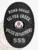 Oval-shaped custom black metal badge for Silver Creek Police Bomb Squad showing the Colorado state seal in the middle, surrounded by white lettering "BOMB SQUAD," "SILVER CREEK," "POLICE DEPARTMENT," and badge number "555," held by a safety pin.