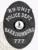 Detailed black oval metal police badge for Harrisonburg K9 Unit featuring the Virginia state seal at its center, bordered by white text stating "K9 UNIT," "POLICE DEPT.," "HARRISONBURG," and number "777," designed with a safety pin attachment.