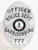 Detailed silver oval police badge for Harrisonburg Officer featuring the Virginia state seal at its center, surrounded by silver banners labeled "OFFICER," "POLICE DEPT.," "HARRISONBURG," and the number "777," designed with a safety pin attachment.