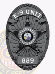 Black oval custom metal badge for Clearwater police K-9 unit showing a raised five-point star with textured detailing, central colorful Florida state emblem, white text banners reading K-9 UNIT on top and CLEARWATER POLICE DEPT. encircling the seal, with number 889 displayed on a black plate near the bottom; badge includes safety pin attachment.