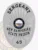 Custom metal badge in silver with safety pin attachment, designed for a sergeant at the New Hampshire State Prison. The badge features a central state emblem, surrounded by the text "SERGEANT" at the top and "NEW HAMPSHIRE STATE PRISON" at the bottom. Its sleek silver finish provides a modern and professional appearance, while the safety pin attachment ensures secure fastening to uniforms, making it both functional and visually appealing.