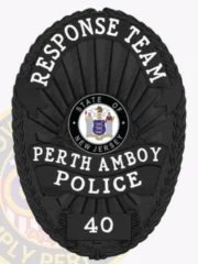 A custom police badge in all black, prominently featuring the words "RESPONSE TEAM" at the top. The badge showcases the emblem for the "STATE OF NEW JERSEY" at its center, surrounded by the text "PERTH AMBOY POLICE." At the bottom, the badge number "40" is displayed, highlighting its sleek, authoritative design with a fully black finish.
