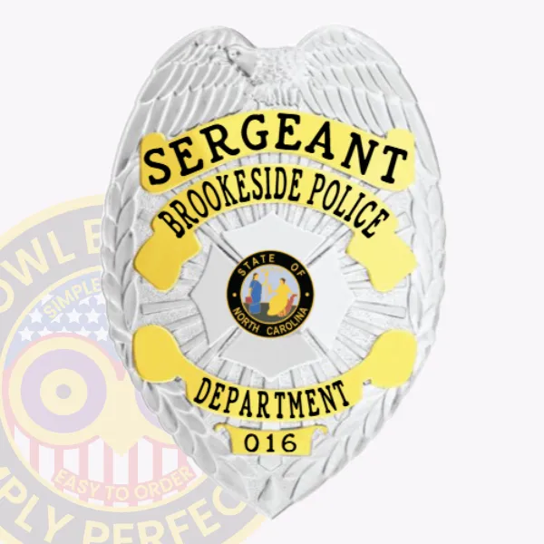 This image captures a polished custom metal badge in silver with gold panels, showcasing "SERGEANT" at the top along with "BROOKESIDE POLICE." The badge features the state emblem of North Carolina and identifies as belonging to the department with badge number 016. The safety pin attachment is clearly visible for easy wear.