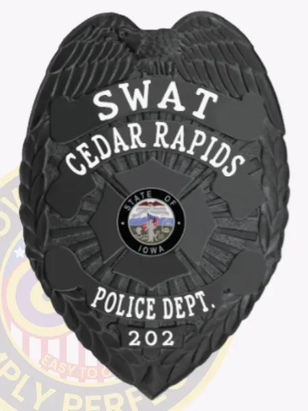 Custom black metal badge for Cedar Rapids police SWAT unit showing a finely detailed eagle at the top edge, bold white text SWAT over CEDAR RAPIDS curved around the colorful Iowa state seal in the middle, POLICE DEPT. and 202 engraved beneath, attached through a safety pin clasp.
