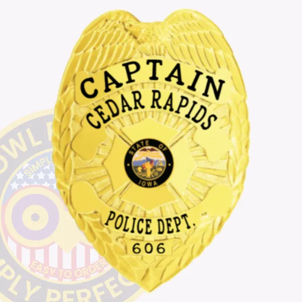 Metal custom badge in gold finish for Cedar Rapids police captain, displaying an eagle with detailed feathers atop the shield shape, black text CAPTAIN in large font, CEDAR RAPIDS beneath it, a colorful State of Iowa seal in the middle, POLICE DEPT. and number 606 at the bottom, attached by safety pin.