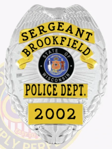 Brookfield Police Sergeant custom silver metal badge showcasing an eagle with spread wings atop the shield, yellow banners with black text highlighting rank and department, centered around a multicolor Wisconsin state seal, finished with badge number "2002" and a velcro fastener.
