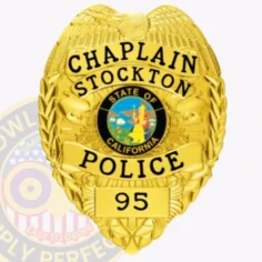 A beautifully crafted custom metal badge in gold color with a safety pin attachment features the inscriptions "chaplain," "stockton," and "police. " the badge's centerpiece showcases the california state seal in vibrant colors, symbolizing dedication and community service.