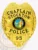 This custom metal badge in gold color with a safety pin attachment prominently displays "CHAPLAIN," "STOCKTON," and "POLICE." The badge features a vibrant central emblem showcasing the California state seal, surrounded by intricate golden detailing that signifies authority.