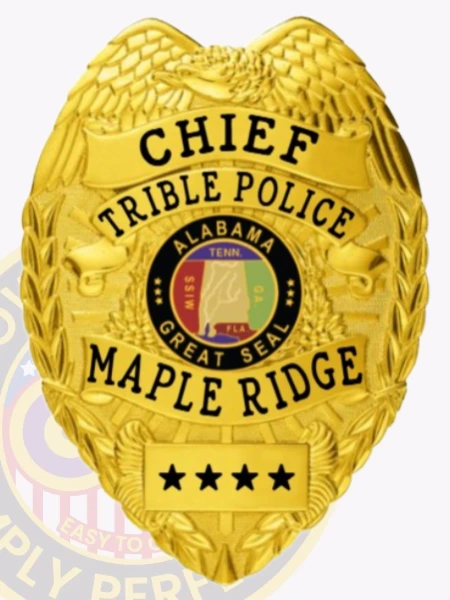 A custom metal badge in gold, designated for the Chief of Tribal Police. The badge prominently displays 'CHIEF TRIBLE POLICE' at the top and 'MAPLE RIDGE' at the bottom, with a detailed circular emblem of the Great Seal of Alabama in the center. Four stars adorn the lower part of the badge, and intricate eagle wing designs frame the top, highlighting its official and authoritative appearance.
