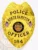 A bright custom metal badge gold, shaped like a shield with detailed engravings. The badge features "POLICE" at the top in bold black letters, followed by "NORTH HAMPTON" beneath it. In the center, the state seal of Utah is displayed within a circular design, flanked by two small American flags. Below the seal, "OFFICER" is prominently written, and the badge includes the number "184" at the bottom. The shiny gold finish of this custom metal badge gold highlights its authority and professionalism, making it an impressive symbol of law enforcement pride.
