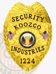 A distinctive custom metal badge in gold color equipped with a safety pin attachment. This badge features "SECURITY" at the top and "KOOZCO INDUSTRIES" prominently displayed, framed by an eagle emblem and colorful elements, enhancing its authoritative appearance and role in security operations.