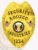 A distinctive custom metal badge in gold color equipped with a safety pin attachment. This badge features "SECURITY" at the top and "KOOZCO INDUSTRIES" prominently displayed, framed by an eagle emblem and colorful elements, enhancing its authoritative appearance and role in security operations.