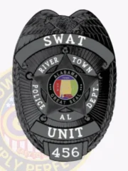 Custom metal badge in a sleek black hue, clearly displaying "SWAT" at the top. This badge includes the text "RIVER TOWN POLICE DEPT." and features the Alabama state seal in a star format, with the number "456" prominently displayed. It has a safety pin attachment for reliable wear.