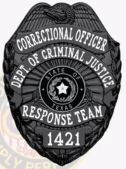 A custom metal badge in a sleek black color, shaped like a shield, representing a Correctional Officer from the Department of Criminal Justice in Texas. The badge prominently features "CORRECTIONAL OFFICER" at the top, followed by "DEPT. OF CRIMINAL JUSTICE" in bold white letters. In the center, it showcases the state seal of Texas, surrounded by decorative elements. The badge reads "RESPONSE TEAM" and the number "1421" at the bottom, and includes a safety pin attachment on the back for secure wear by correctional personnel, emphasizing its practical design and authority.