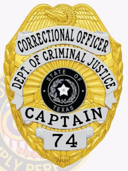 A custom metal badge featuring a gold base with silver panels, shaped like a shield, representing a Correctional Officer from the Department of Criminal Justice in Texas. The badge prominently displays "CORRECTIONAL OFFICER" at the top, followed by "DEPT. OF CRIMINAL JUSTICE" on a silver panel beneath it. In the center, it features the state seal of Texas, encircled by decorative elements. The badge reads "CAPTAIN" and the number "74" at the bottom, and includes a safety pin attachment on the back for secure wear by correctional personnel, highlighting its practical design and authority.