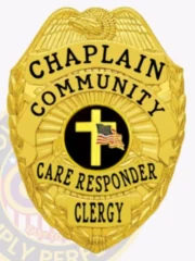 This custom metal badge in gold color with a safety pin attachment prominently displays "CHAPLAIN," "COMMUNITY," and "CARE RESPONDER." The badge features a central black circle showcasing a white cross with an American flag, surrounded by intricate golden detailing.