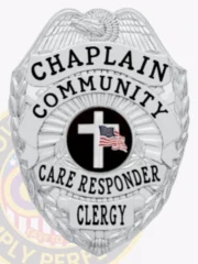 A striking custom metal badge in silver color with a safety pin attachment highlights the titles "CHAPLAIN," "COMMUNITY," and "CLERGY." The design includes a vibrant central emblem featuring a cross, symbolizing faith and commitment to community service.