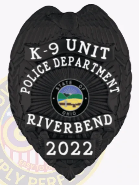 Riverbend Police K-9 Unit custom black metal badge, showing an eagle with outstretched wings at the top, bold white lettering surrounding the Ohio state emblem, labeled “K-9 UNIT” and dated “2022,” equipped with a safety pin fastener.