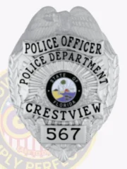 Polished custom silver metal badge for Crestview Police Officer, featuring an eagle at the crest, black text reading "POLICE OFFICER POLICE DEPARTMENT CRESTVIEW," with the Florida state seal in the center and numbered "567," equipped with a safety pin attachment.