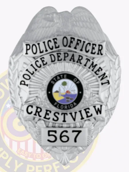 Polished custom silver metal badge for Crestview Police Officer, featuring an eagle at the crest, black text reading "POLICE OFFICER POLICE DEPARTMENT CRESTVIEW," with the Florida state seal in the center and numbered "567," equipped with a safety pin attachment.