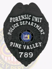 A custom metal badge in a sleek black color, prominently displaying "FORENSIC UNIT" at the top and "POLICE DEPARTMENT" below. The badge features the state emblem of New York within a circular design, accompanied by "PINE VALLEY" and badge number "789." It includes a safety pin attachment for secure wear on uniforms.