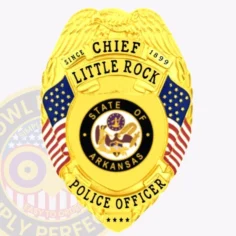 A bright custom metal badge gold, shaped like a shield with intricate detailing. The badge features "chief" at the top, followed by "little rock" and "since 1899" in elegant lettering. In the center, the state seal of arkansas is displayed within a circular black ring, surrounded by two small american flags on either side. Below the seal, "police officer" is prominently written in bold letters. The shiny gold finish of this custom metal badge gold emphasizes its authority and professionalism, making it a distinguished symbol of law enforcement pride.