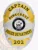 Silver custom oval metal badge for Pinecrest Police captain, featuring a radiant sunray background, gold banners with black text for "CAPTAIN," "PINECREST," "POLICE DEPARTMENT," and badge number "202," with the State of Maine seal prominently positioned and safety pin attachment on back.