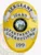 Custom metal badge in gold featuring silver panels, designed for a sergeant in the Idaho Department of Corrections. The badge showcases the state emblem in the center, surrounded by the text "SERGEANT" at the top and "DEPARTMENT OF CORRECTIONS" at the bottom. The badge has a velcro attachment on the back for easy wear and display.
