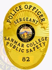 A custom metal police badge in all gold, featuring the title "POLICE OFFICER" at the top and "SERGEANT" just below it. The badge displays the emblem for the "STATE OF IOWA" at its center, surrounded by the text "SANMAR COLLEGE PUBLIC SAFETY." At the bottom, the badge number "82" is prominently shown, highlighting its shiny gold finish and official design.