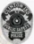 A detailed police badge in silver with black panels, featuring the text 'CLINTON ISD K9' at the top. The badge showcases 'PUBLIC SAFETY POLICE' prominently, with the state emblem of Texas at its center. The design includes intricate details and contrasting black panels, enhancing its authoritative appearance and highlighting its significance in law enforcement.