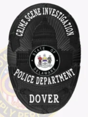 Black custom oval flex badge displaying the Capitol building silhouette with the Delaware state seal at its center, labeled with bold white letters "CRIME SCENE INVESTIGATION" above, "POLICE DEPARTMENT" below, and "DOVER" at the base, designed for Dover Police and secured by a safety pin.