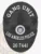 Black custom oval metal badge for Los Angeles police gang unit highlighting a textured city hall emblem in the center of a dark shield, with bold white text GANG UNIT at the top and LOS ANGELES POLICE in the middle, along with a black number plate 26-7441 at the base, designed with safety pin fastening.