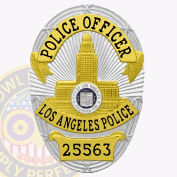 Oval custom metal police badge for Los Angeles officers showcasing a prominent gold city hall emblem centered on a silver shield with sun rays design, accented by yellow banners labeled POLICE OFFICER and LOS ANGELES POLICE, along with a numbered yellow plate 25563 at the bottom, equipped with a velcro attachment.