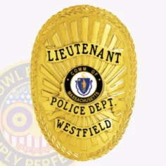 Gold custom oval metal badge for westfield police lieutenant, featuring a bright gold laurel leaf border with sunray background, black text on gold ribbons stating "lieutenant," "police dept. ," and "westfield," with the commonwealth of massachusetts seal prominently displayed and safety pin attachment.