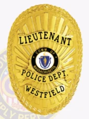 Custom gold oval metal badge for Westfield police the lieutenant with safety pin attachment, featuring a bright gold laurel wreath border and sunburst background, black text on gold banners reading "LIEUTENANT," "POLICE DEPT.," and "WESTFIELD," surrounding the Commonwealth of Massachusetts seal in the center.