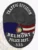Oval black metal badge designed for Belmont Police Traffic Division, showing an eagle emblem above the American flag and Alabama state seal, with bold white lettering "TRAFFIC DIVISION," "BELMONT," "POLICE DEPT.," and "333," fastened by a safety pin.