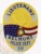 Detailed gold oval police badge for Belmont Police Lieutenant highlighting an eagle at the crest above the Alabama state seal and American flag, framed by silver text banners reading "LIEUTENANT," "BELMONT," "POLICE DEPT.," and badge number "111," designed with a safety pin.