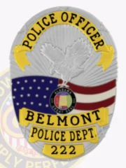 Silver custom oval metal badge for Belmont Police Officer featuring an eagle embossed at the top over an American flag and Alabama state seal, accented by yellow text banners with "POLICE OFFICER," "BELMONT," "POLICE DEPT.," and badge number "222," attached with a safety pin.