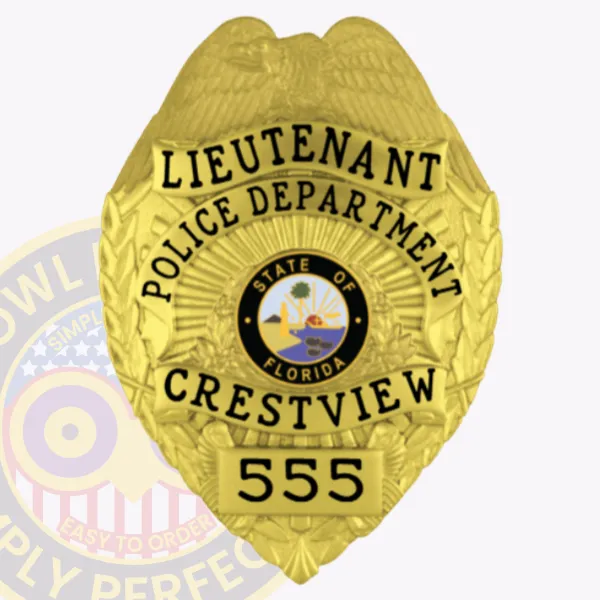 Crestview Police Lieutenant’s custom gold metal badge showing a detailed gold eagle crest on top, bold black letters spelling "LIEUTENANT POLICE DEPARTMENT CRESTVIEW," Florida state seal in the center and number "555" on a gold plate below, attached with a safety pin.