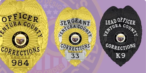 Three custom corrections badges displayed in various finishes: a bright gold badge labeled 'OFFICER VENTURA COUNTY CORRECTIONS' with the number '984,' a silver badge marked 'SERGEANT VENTURA COUNTY CORRECTIONS' featuring the number '33,' and a sleek black badge reading 'LEAD OFFICER VENTURA COUNTY CORRECTIONS K9.' Each badge includes a central emblem representing the state of Arizona. This image illustrates how to buy custom corrections badges, correctional badges, prison badges, jail badges, and black badges online.