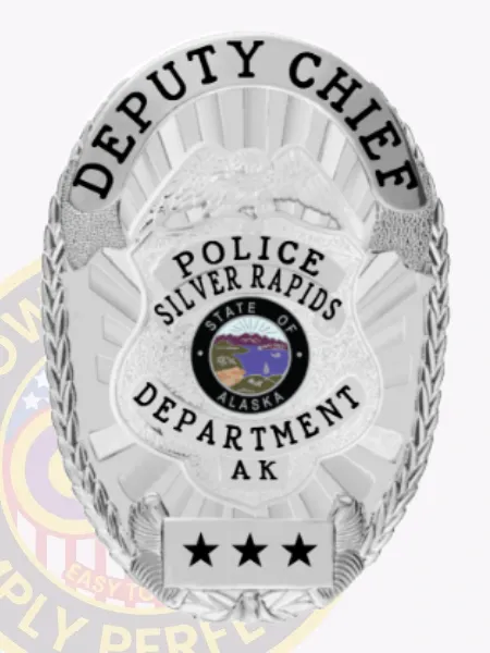A polished custom metal badge in silver, prominently displaying "DEPUTY CHIEF" at the top. The center features "POLICE SILVER RAPIDS" alongside an emblem for "STATE OF ALASKA." Below, the badge includes "DEPARTMENT AK" and three stars at the base. Designed with a safety pin attachment, this badge ensures secure and convenient wear on uniforms.
