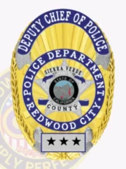 A striking custom metal badge in gold with vibrant silver and blue reverse enamel panels highlights the title "DEPUTY CHIEF OF POLICE" prominently at the top. The design includes a circular emblem featuring the state seal of California, surrounded by "POLICE DEPARTMENT," "SIERRA VERDE," and "REDWOOD CITY." The badge is marked with three stars at its base and includes a safety pin attachment for stability.